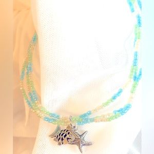 Triple strand beach theme anklet with fish and starfish charm